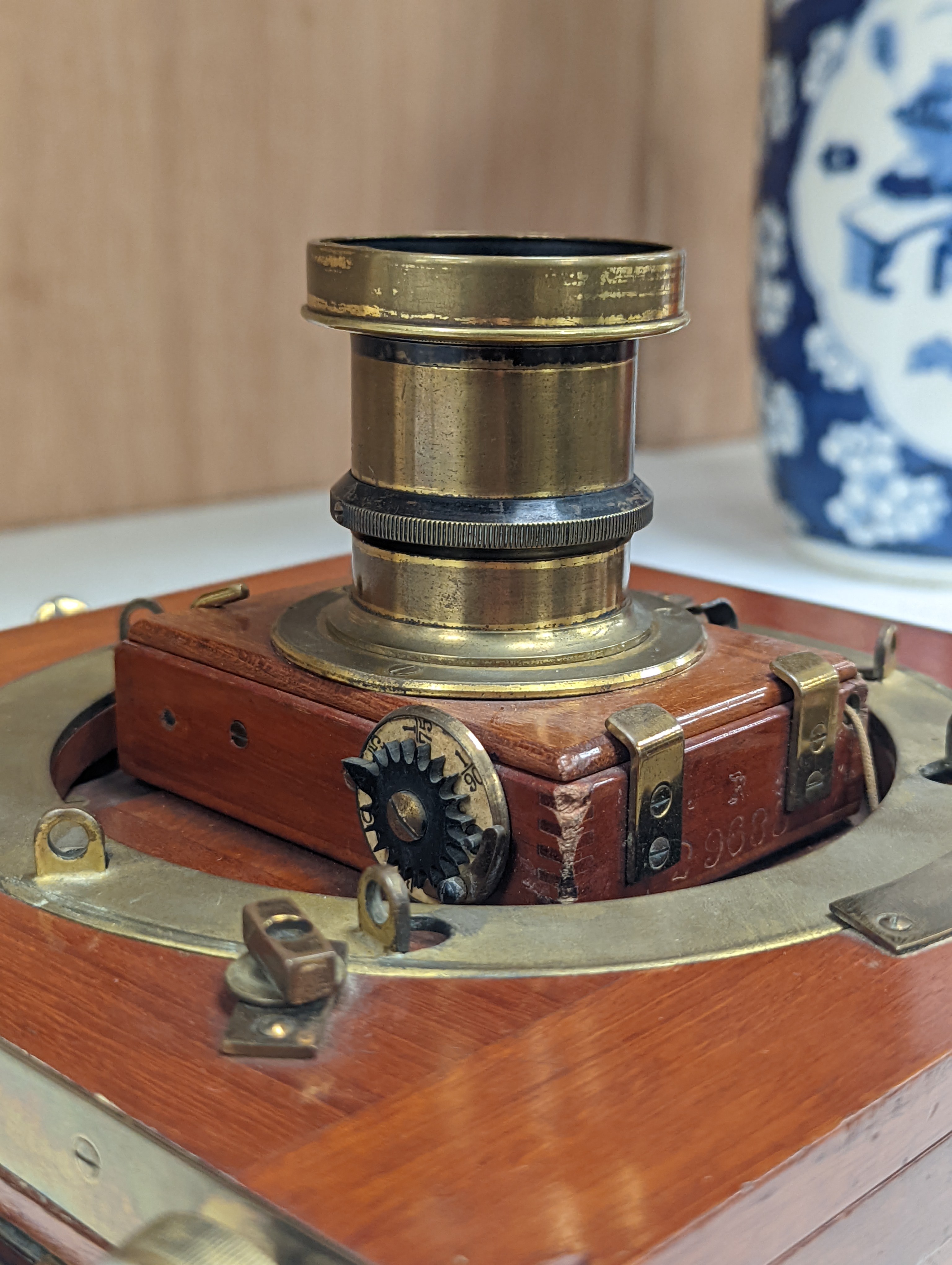 A Thornton Pickard mahogany and brass plate camera, three plates and a stand, 20cm sq.